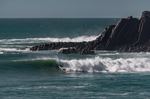 Matthew doing a Grab rail bottom turn on a step up surfboard at a point break in the Algarve.